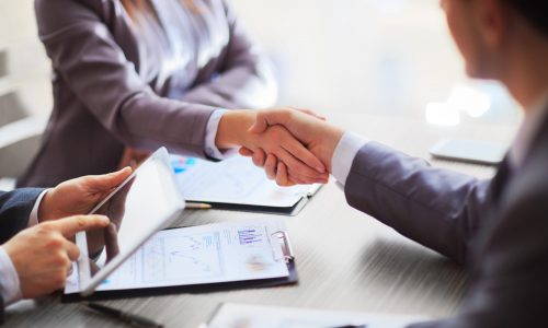 Business people shaking hands finishing up a meeting